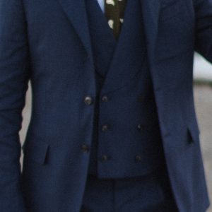 Man in Grayman and Company blue tactical suit wearing doubel breasted shawl waistcoat