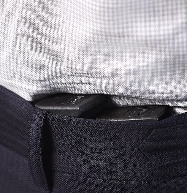 Glock pistol magazines concealed in tactical concealed carry waistband trouser pockets