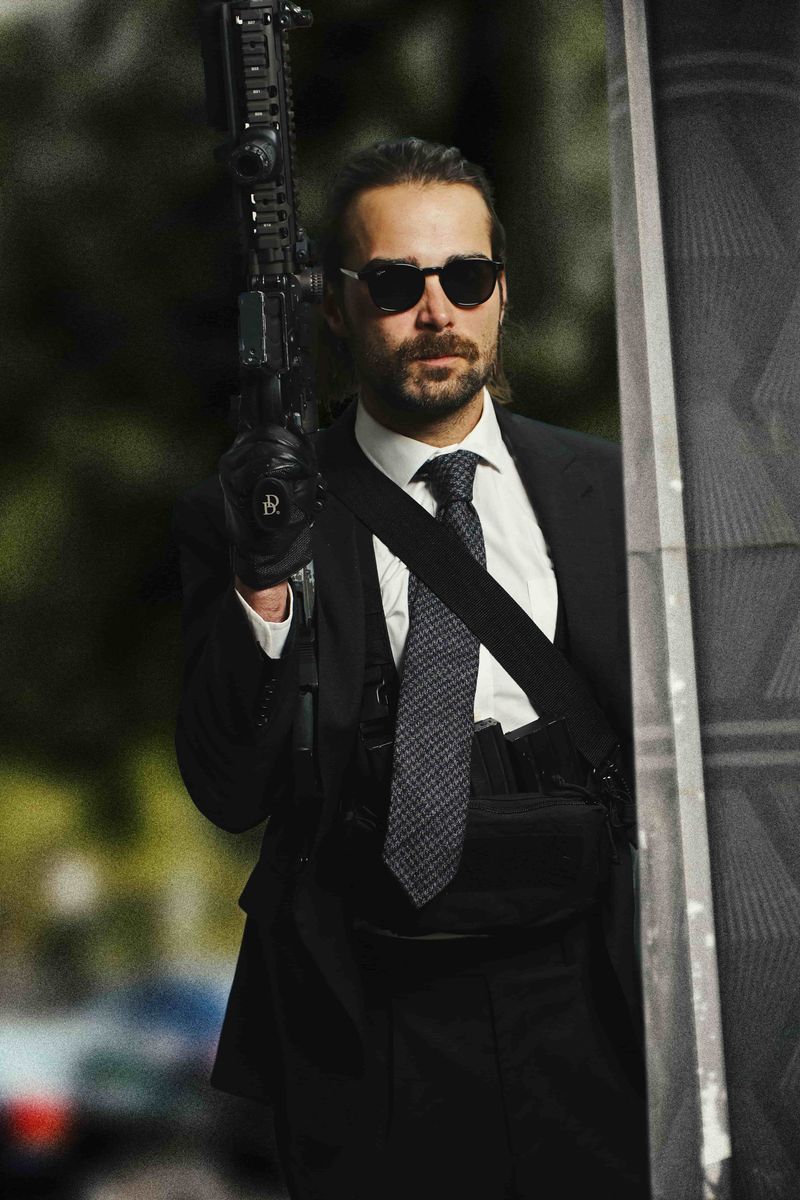 Bank robber with AR15 in Grayman and Company suit and KH12 ballistic tactical sunglasses HEAT film homage