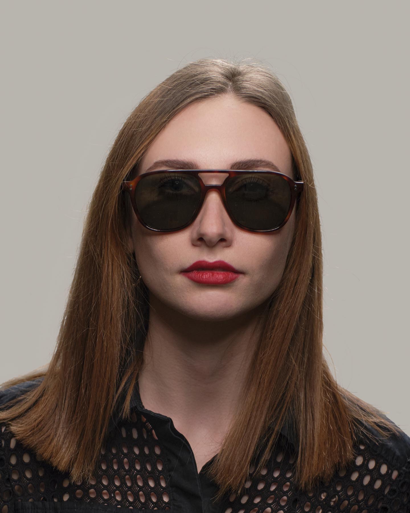 Woman in Grayman and Company 155a tortoise ballistic aviator sunglasses