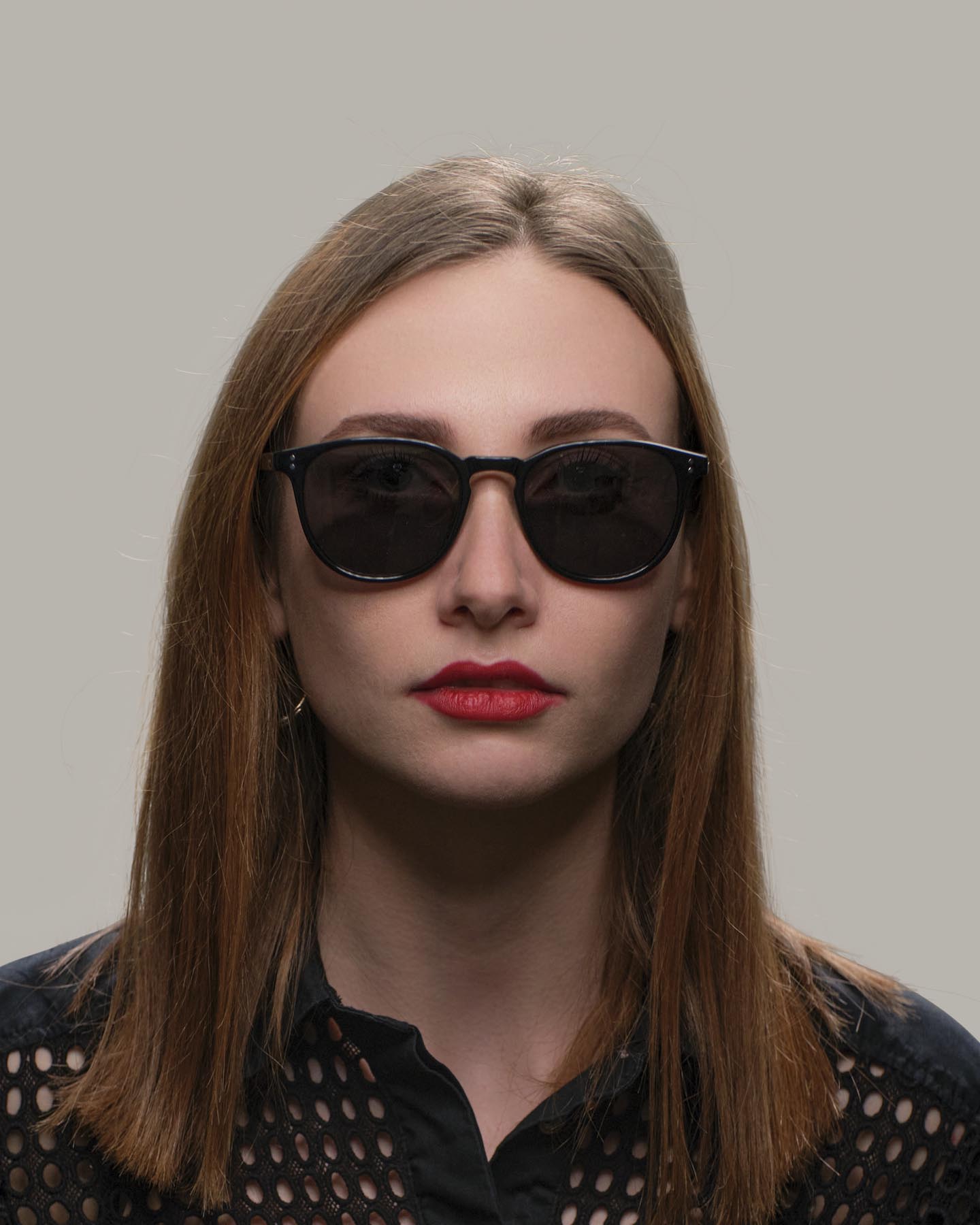 Headshot of woman in Grayman and Company KH11 wayfarer ballistic impact resistant sunglasses