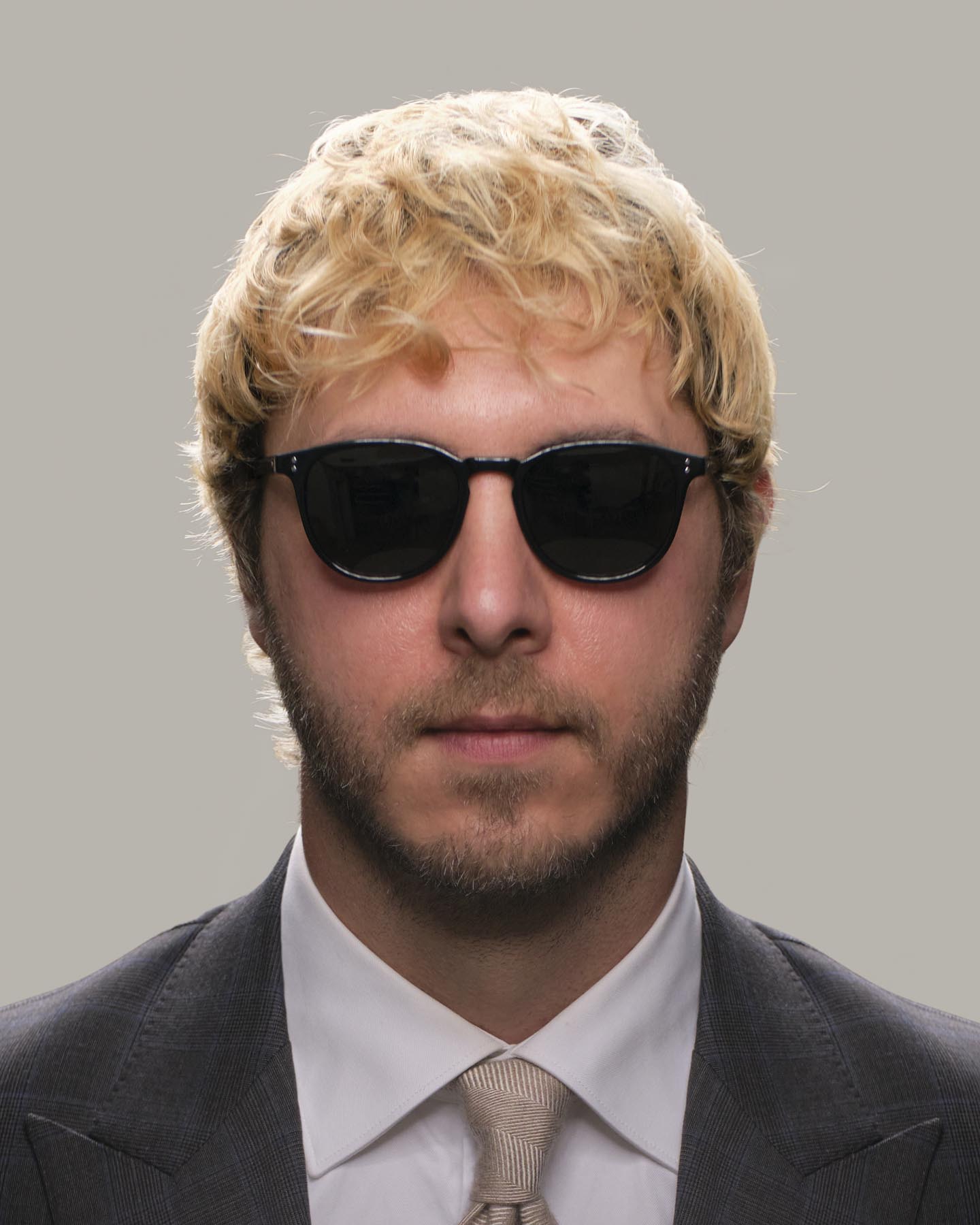 Headshot of man in Grayman and Company black KH11 wayfarer ballistic impact resistant sunglasses