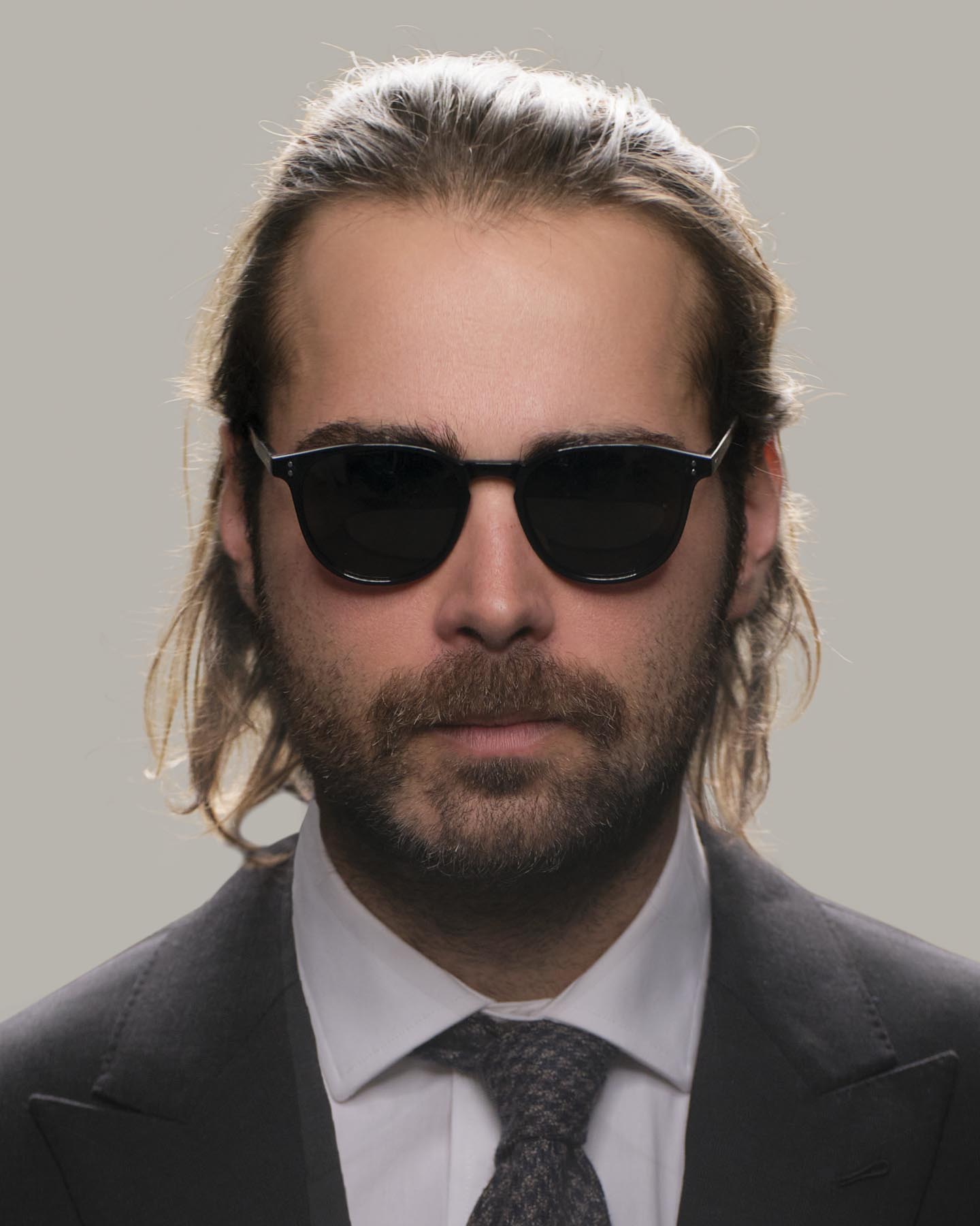 Headshot of man in black Grayman and Company KH11 wayfarer ballistic impact resistant sunglasses