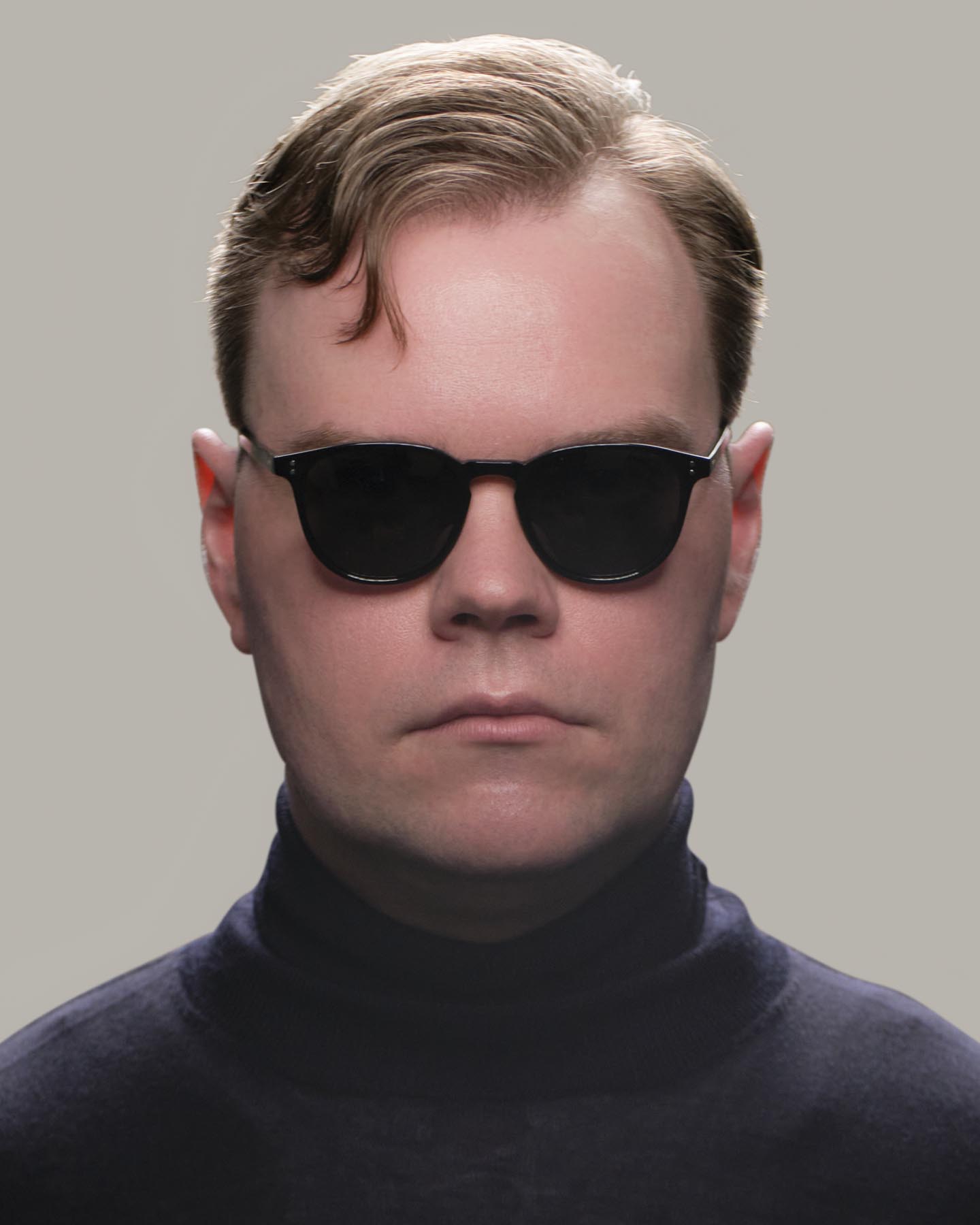 Headshot of man in black Grayman and Company KH11 wayfarer ballistic impact resistant sunglasses